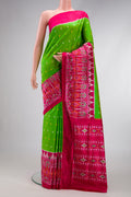 Parrot Green Dual Tone Double Ikat Saree with Ikat Print on the body and Ikat Border.  displayed on a mannequin