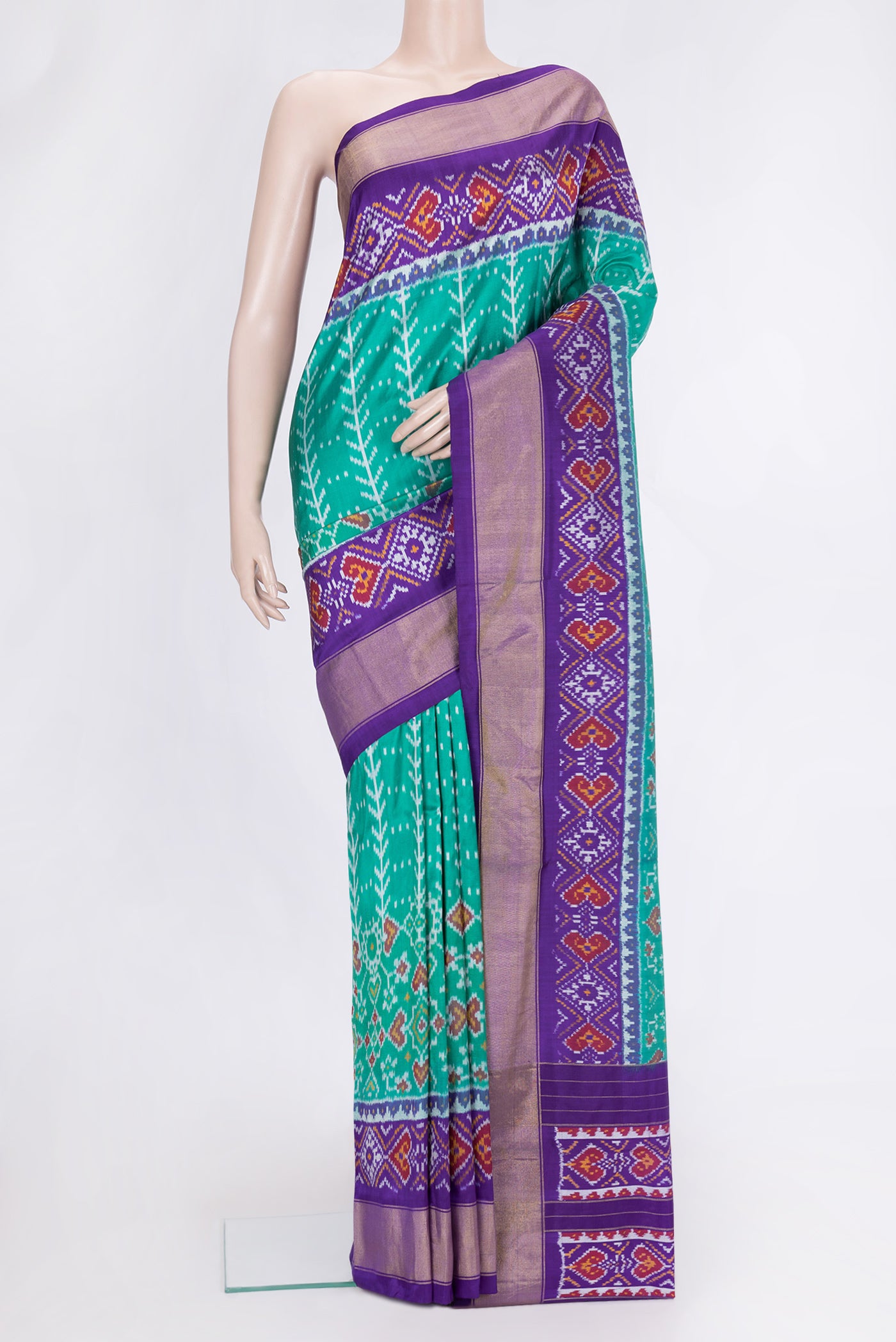 Sea Green Dual Tone Double Ikat Saree with Ikat Print on the body and Ikat Border.  displayed on a mannequin