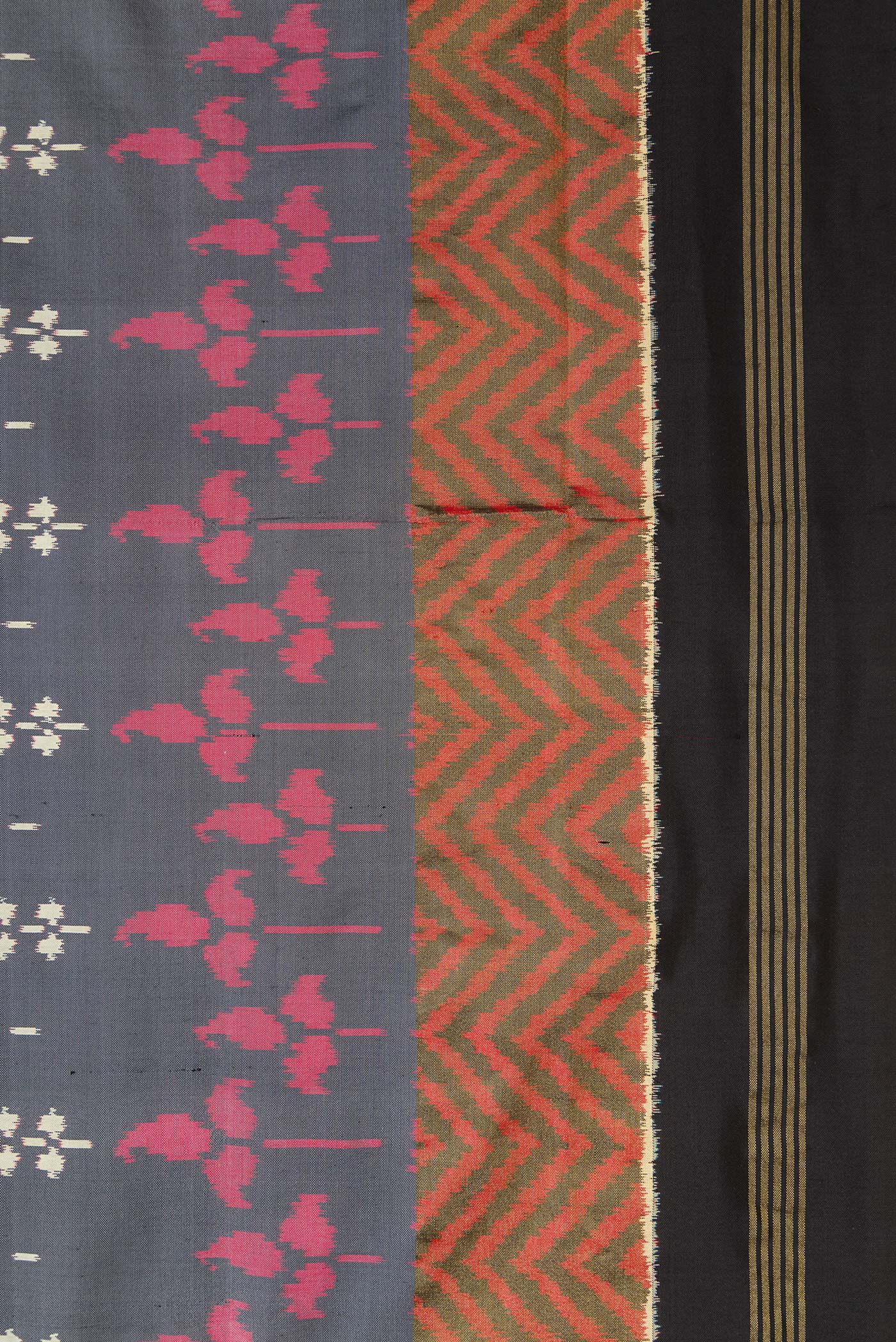 Border image of Grey Dual Tone Double Ikat Saree with Ikat Print on the body and Zari Border. 