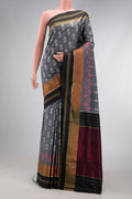 Grey Dual Tone Double Ikat Saree with Ikat Print on the body and Zari Border.  displayed on a mannequin