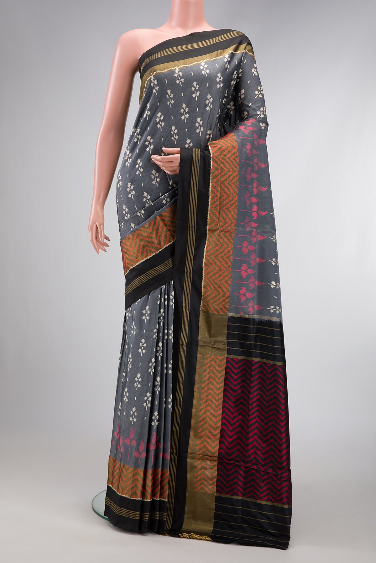 Grey Dual Tone Double Ikat Saree with Ikat Print on the body and Zari Border.  displayed on a mannequin