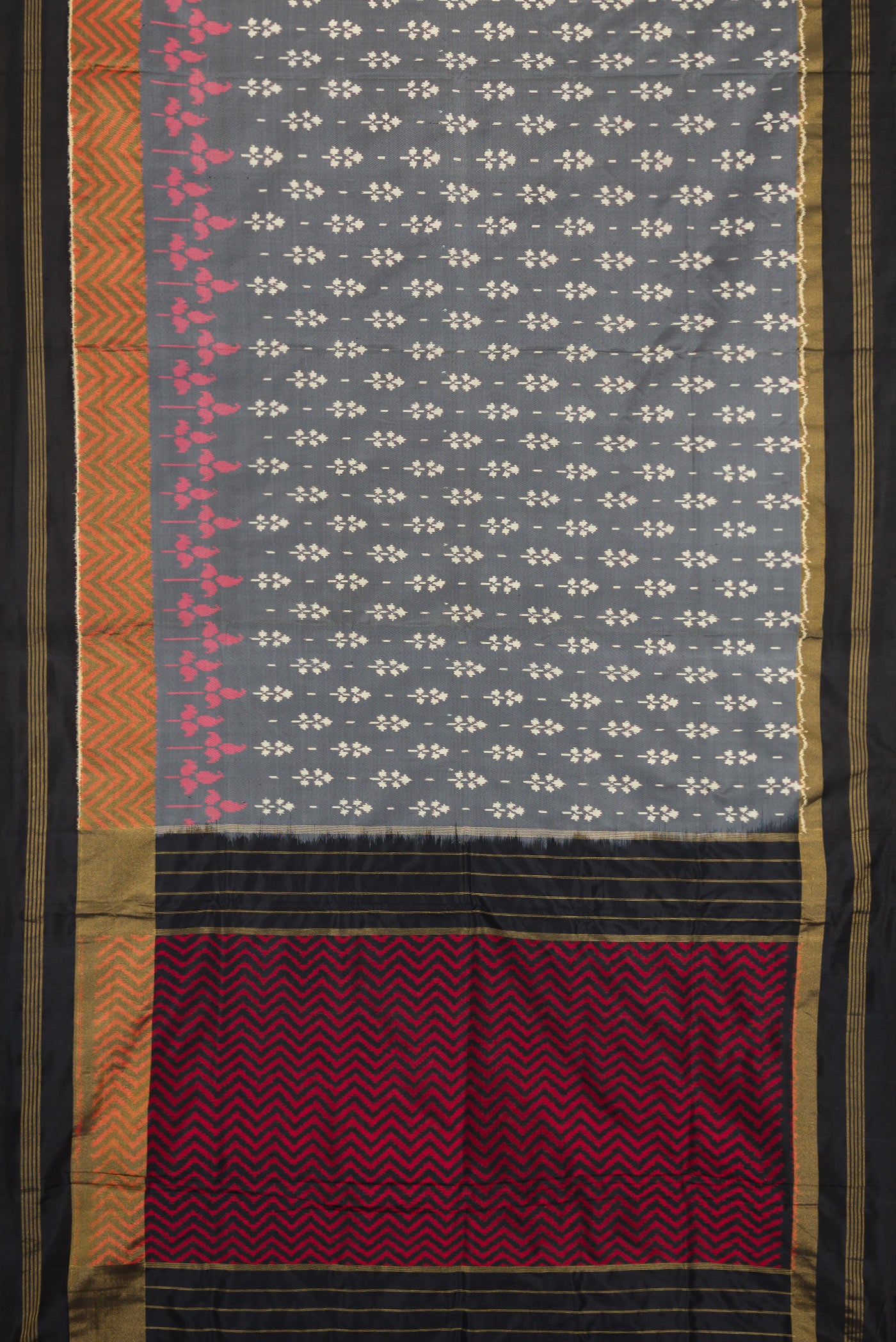 Flat view of Grey Dual Tone Double Ikat Saree with Ikat Print on the body and Zari Border. 
