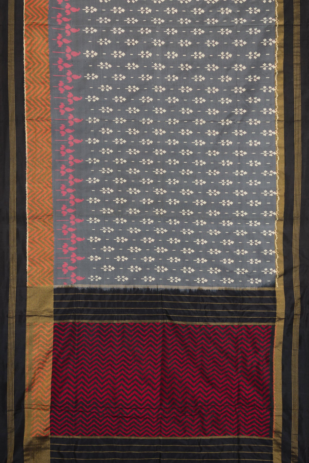 Flat view of Grey Dual Tone Double Ikat Saree with Ikat Print on the body and Zari Border. 