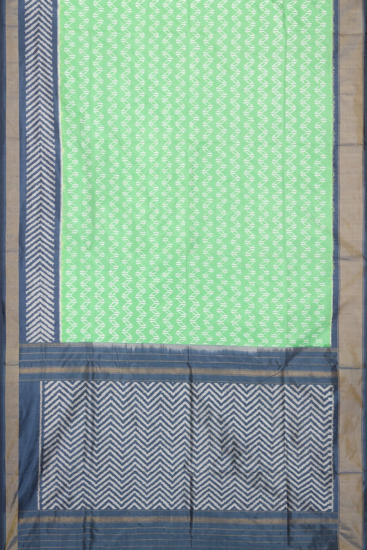 Flat view of Pista Green Dual Tone Double Ikat Saree with Ikat Print on the body and Ikat Border. 