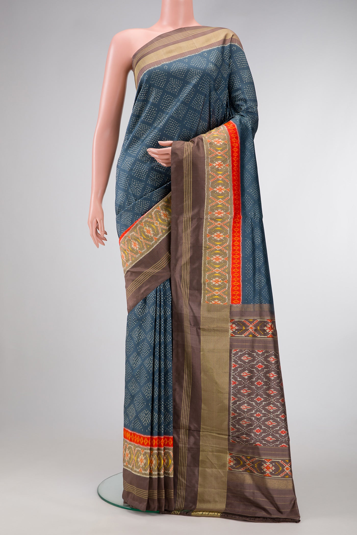 Grey Dual Tone Double Ikat Saree with Ikat Print on the body and Ikat Border.  displayed on a mannequin