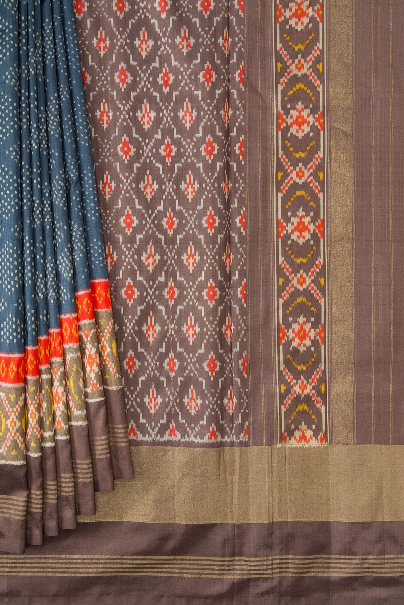 Pleats and pallu of Grey Dual Tone Double Ikat Saree with Ikat Print on the body and Ikat Border. 