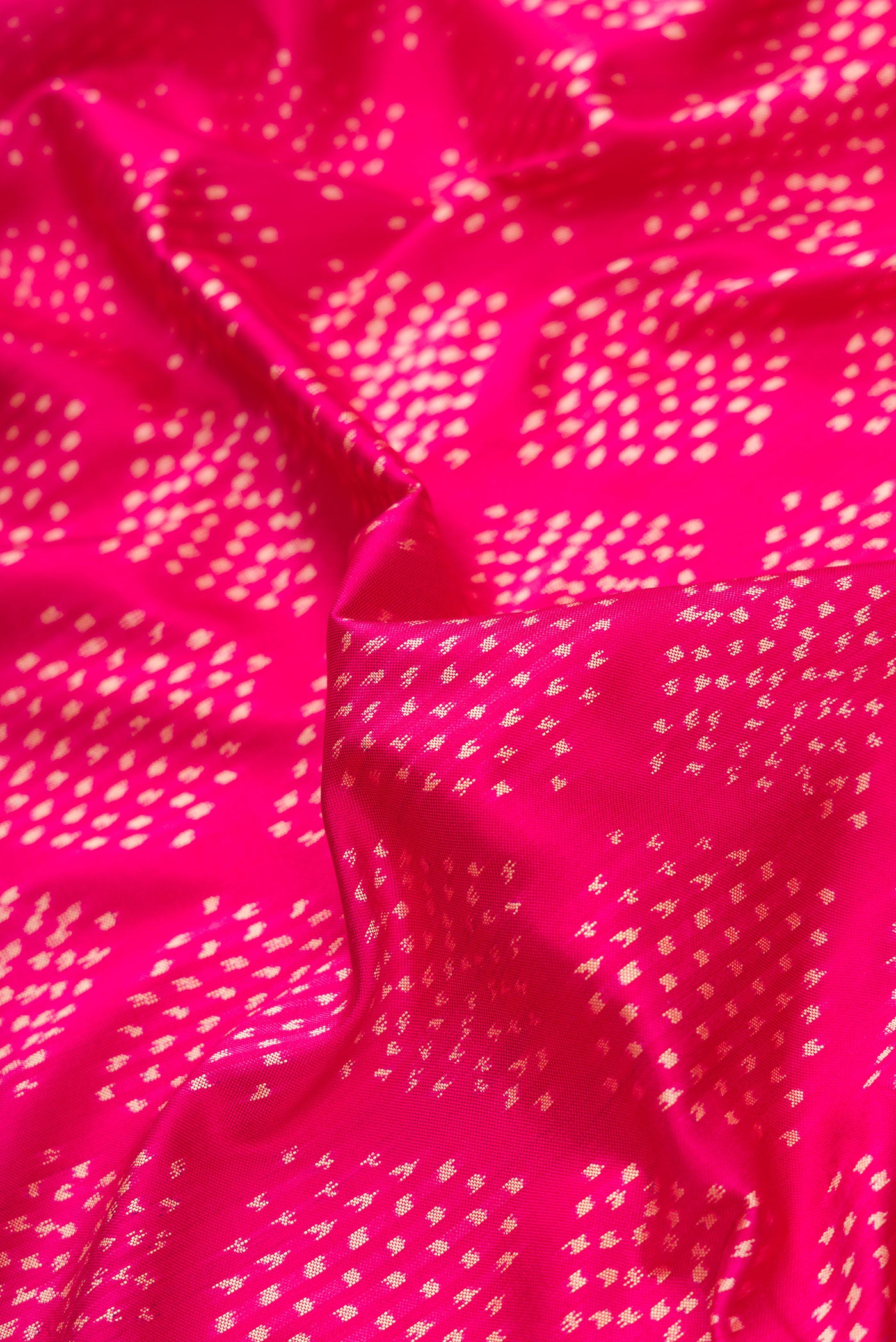 Close up of Pink Dual Tone Double Ikat Saree with Ikat Print on the body and Ikat Border.  displaying folds