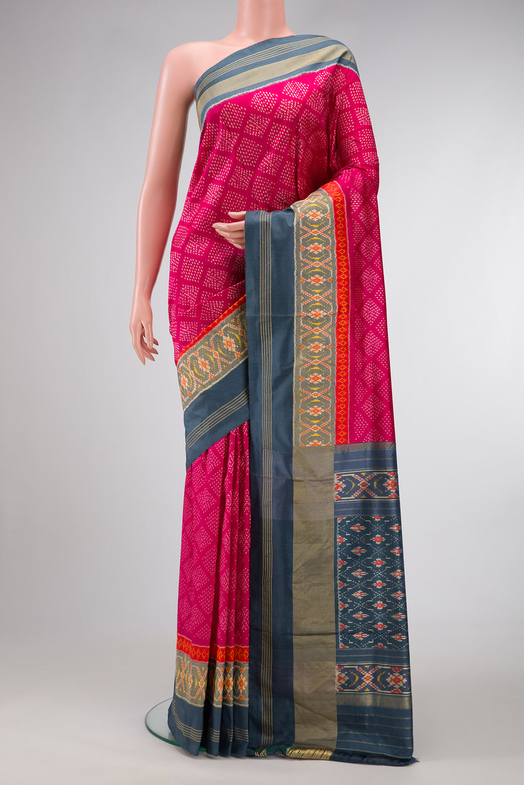 Pink Dual Tone Double Ikat Saree with Ikat Print on the body and Ikat Border.  displayed on a mannequin