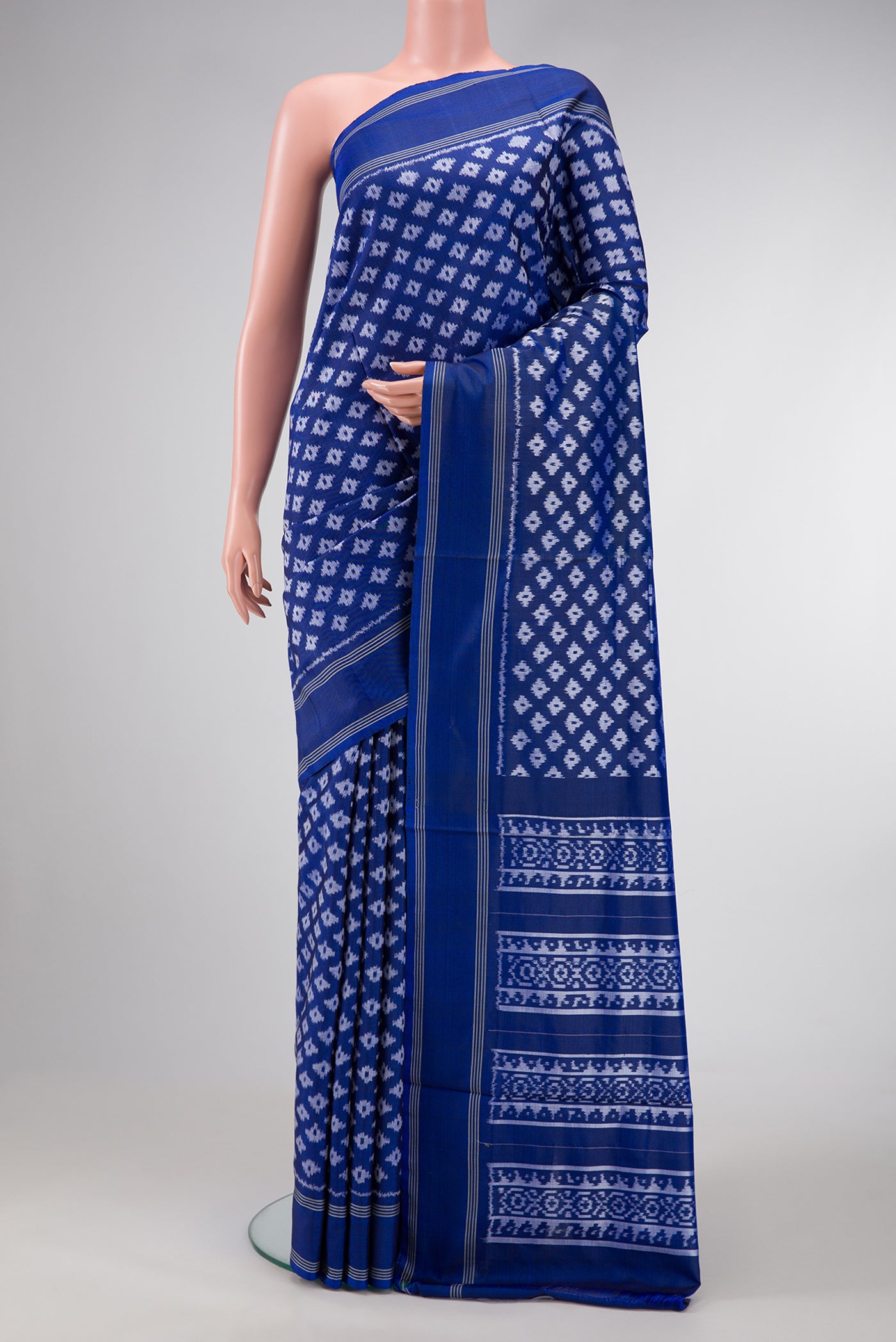 Royal Blue Dual Tone Double Ikat Saree with Ikat Print on the body and Plain Border.  displayed on a mannequin