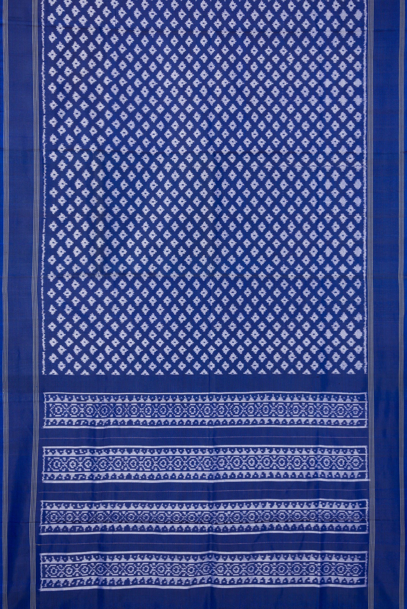 Flat view of Royal Blue Dual Tone Double Ikat Saree with Ikat Print on the body and Plain Border. 