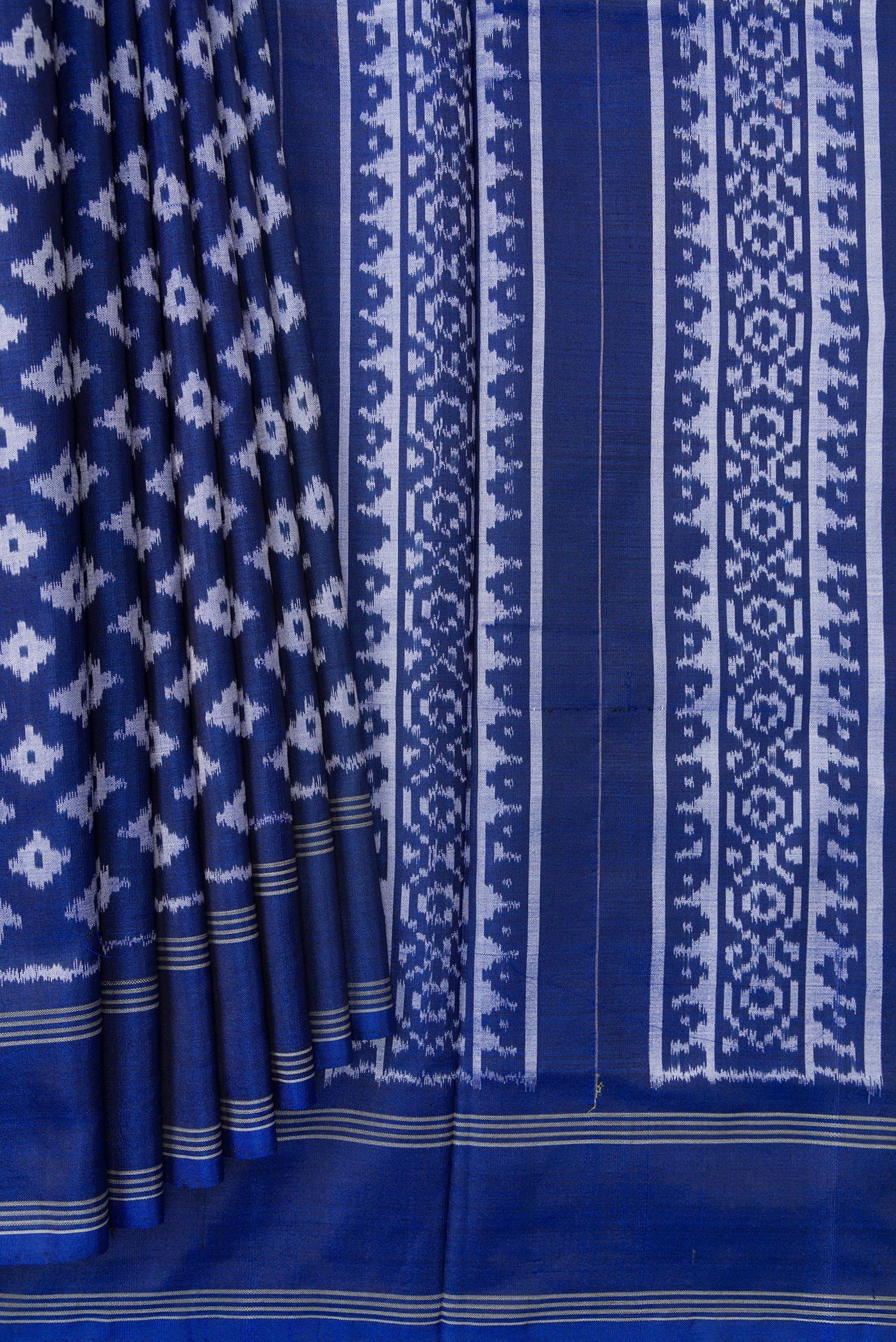 Pleats and pallu of Royal Blue Dual Tone Double Ikat Saree with Ikat Print on the body and Plain Border. 