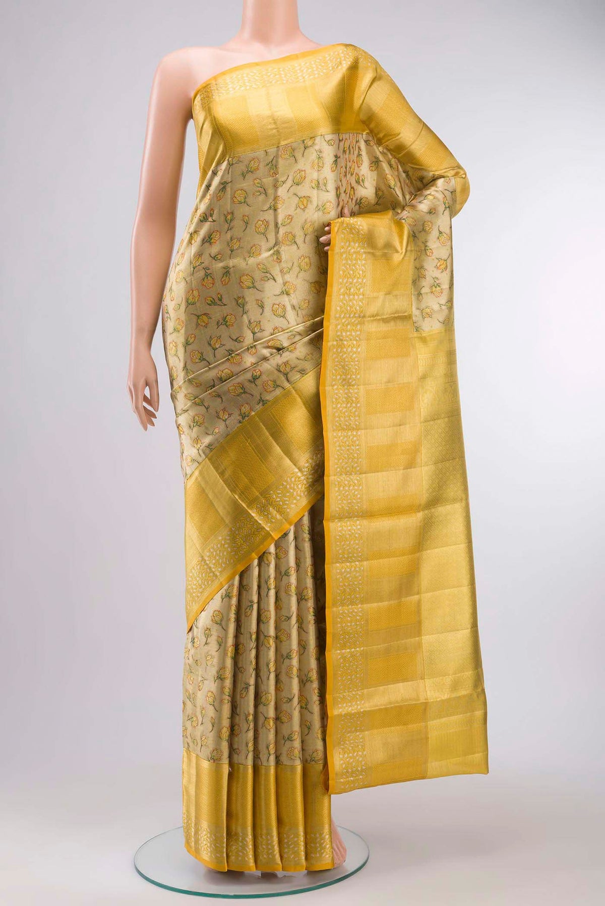 Gold with Green Color Kanchipuram Tissue Silk Saree with Zari Brocade on the body and Zari Border displayed on a mannequin