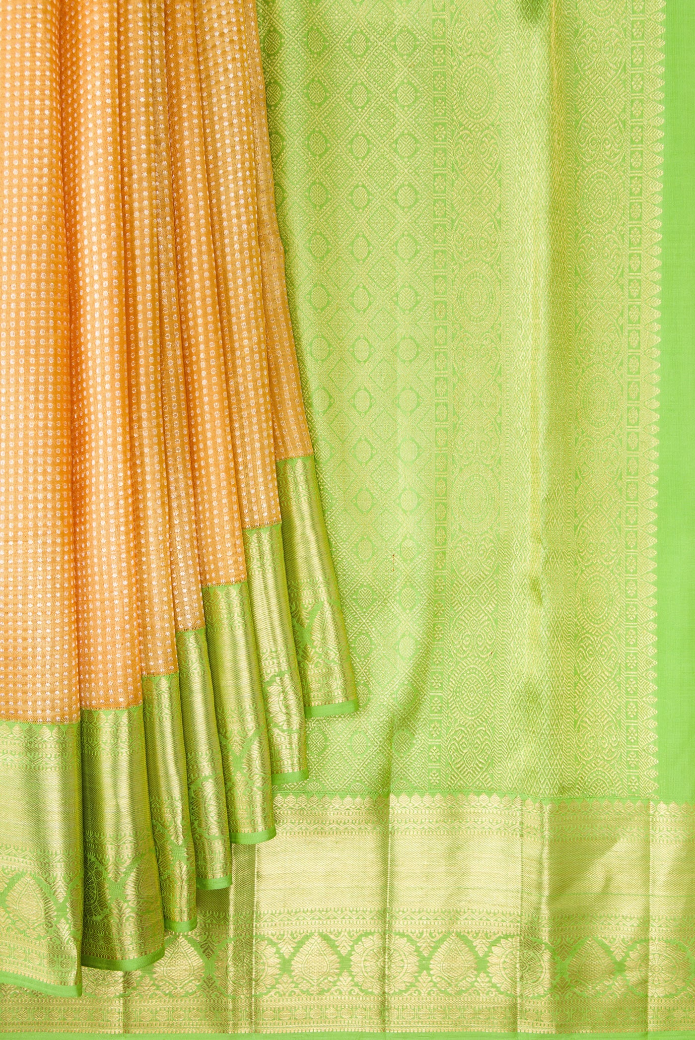 Pleats and pallu of Golden Peach Dual Tone Kanchipuram Tissue Silk Saree with Zari Brocade on the body and Zari Border. 