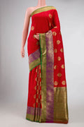 Red Banarasi Tussar Silk Saree with Zari Butta on the body and Zari Border displayed on a mannequin
