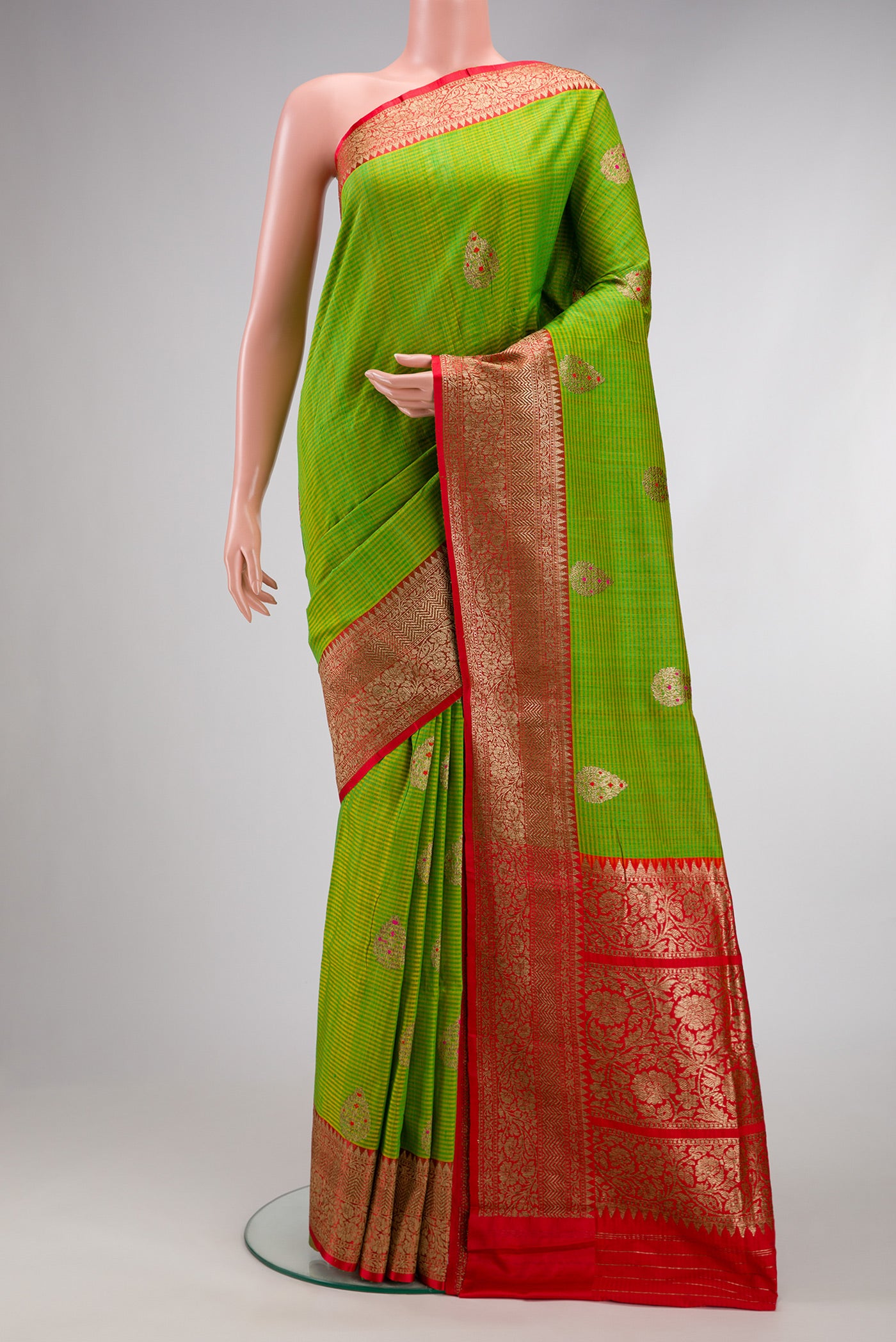 Parrot Green Dual Tone Banarasi Silk Saree with Zari Butta on the body and Fancy Border.  displayed on a mannequin