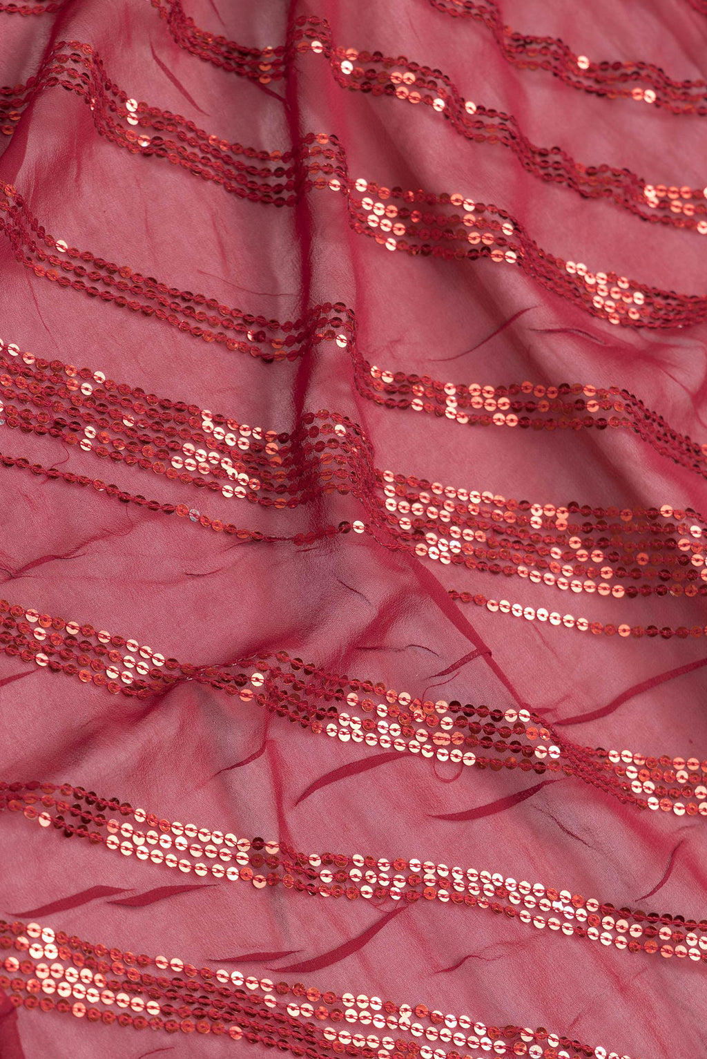 Close up of Maroon Dual Tone Mysore Georgette Saree with Embroidery on the body and Embroidery Border.  displaying folds