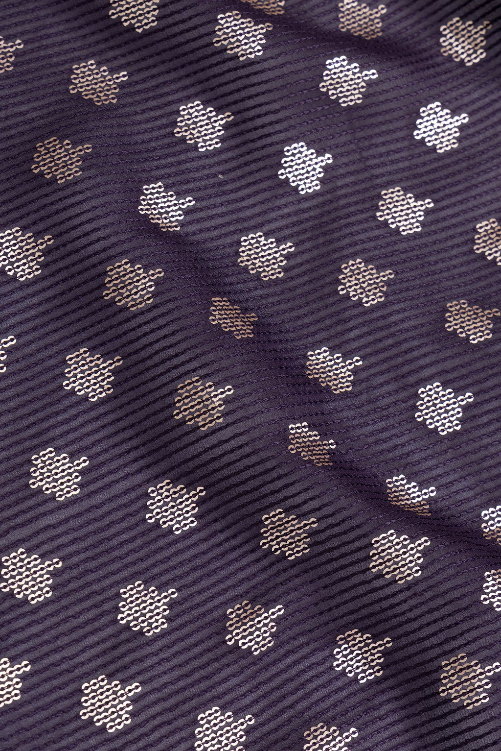Close up of Violet Dual Tone Georgette Saree with Embroidery on the body and Embroidery Border.  displaying folds