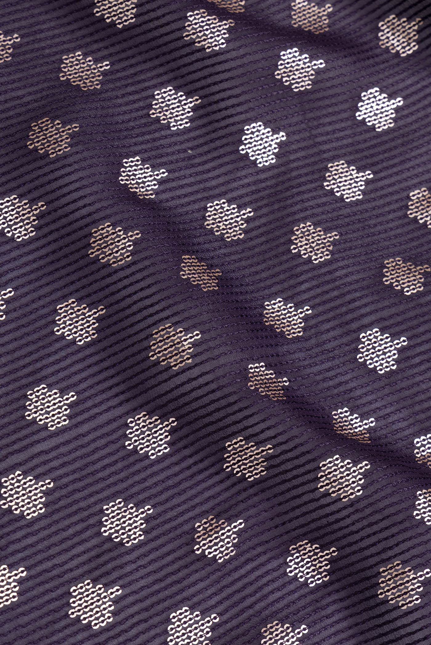 Close up of Violet Dual Tone Georgette Saree with Embroidery on the body and Embroidery Border.  displaying folds