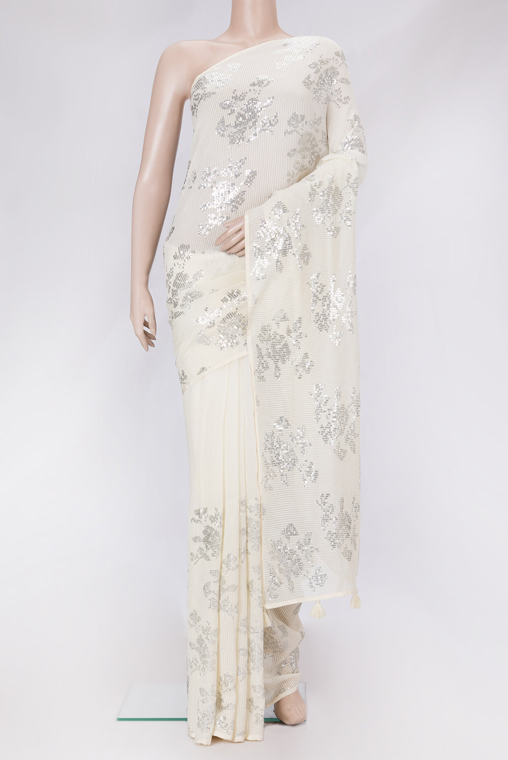 Beige Dual Tone Mysore Georgette Saree with Embroidery on the body and Without Border.  displayed on a mannequin