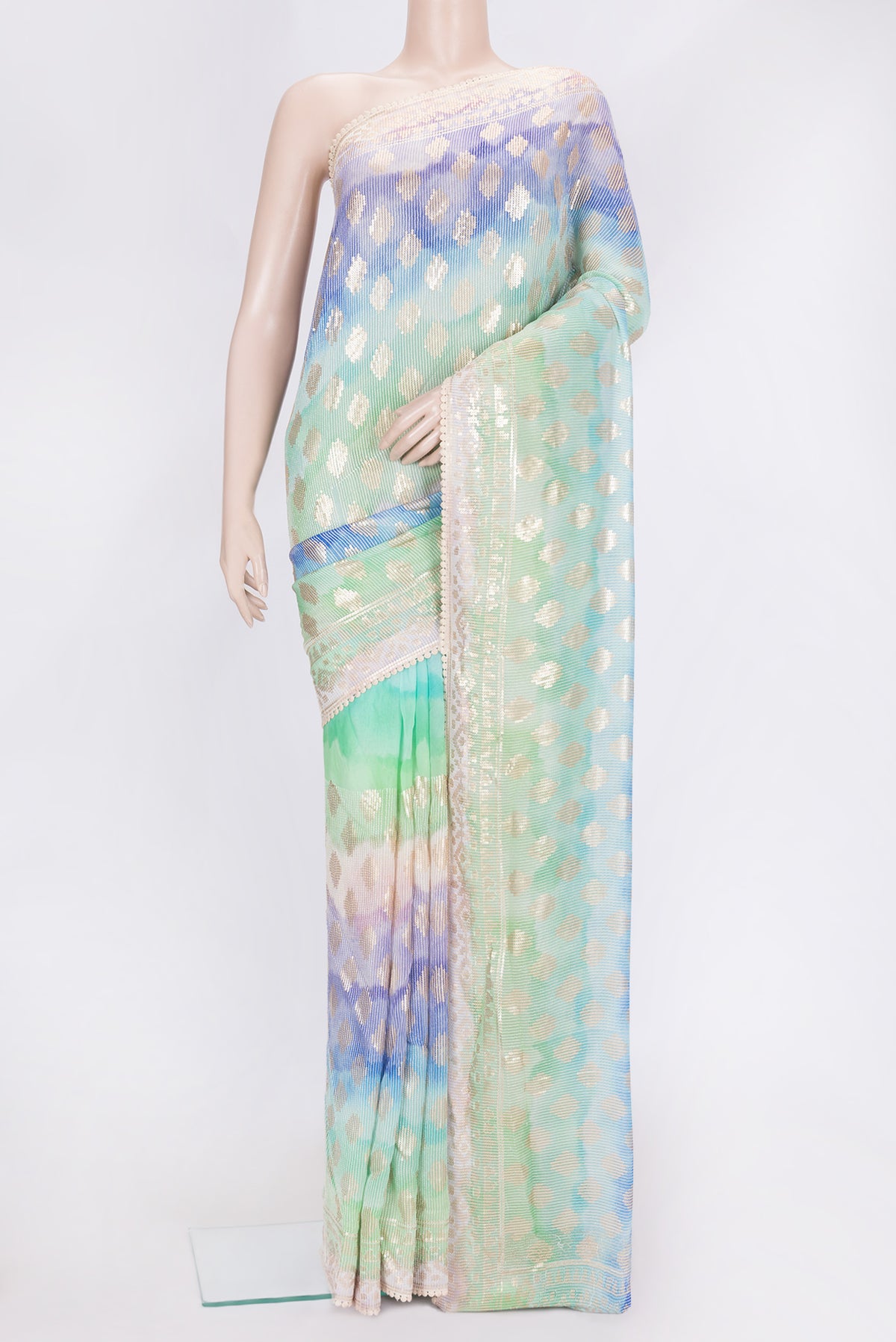 Off White Dual Tone Georgette Saree with Embroidery on the body and Embroidery Border.  displayed on a mannequin
