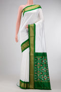Off White Dual Tone Double Ikat Saree with Plain Body and Zari Border.  displayed on a mannequin