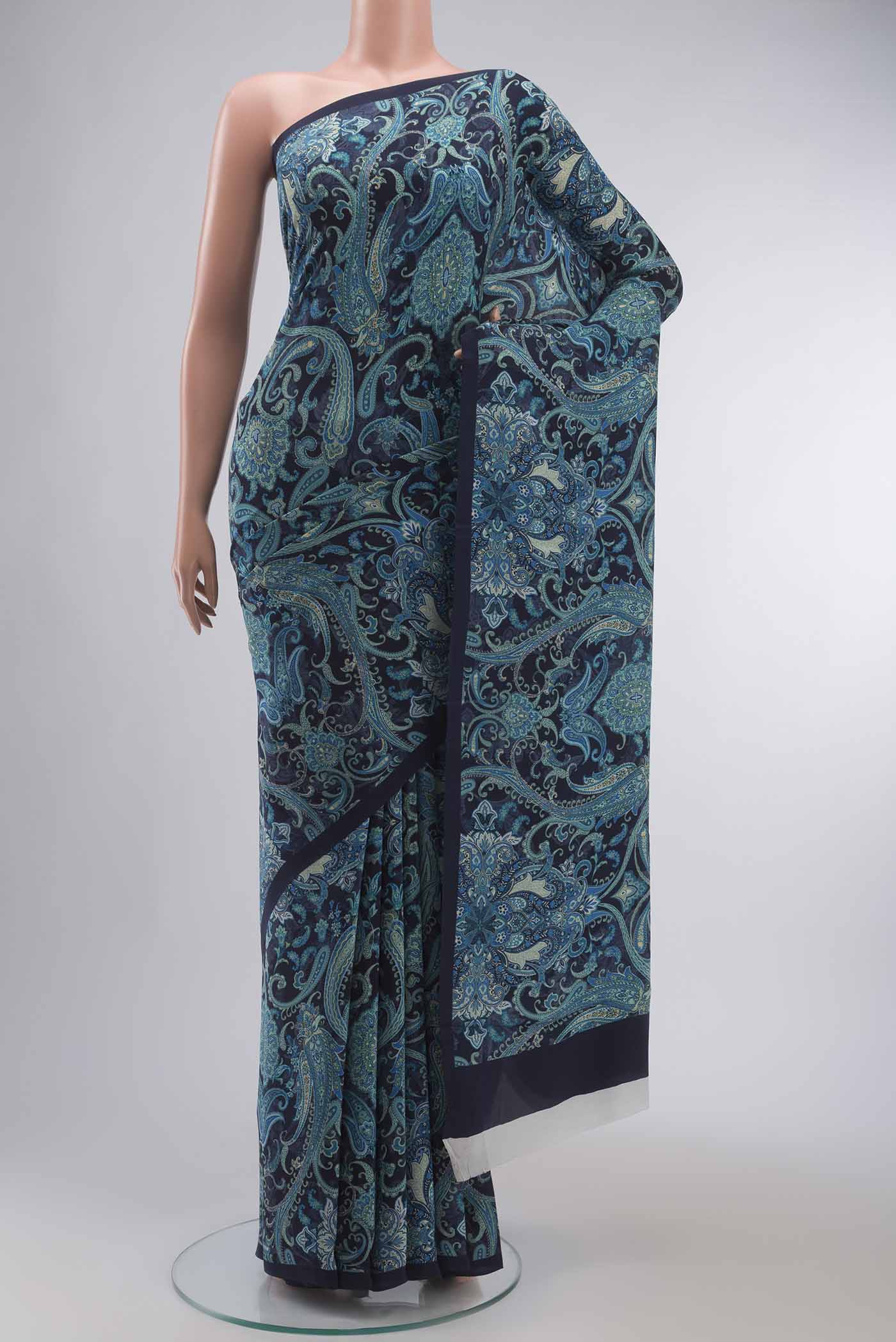 Navy Blue Mysore Crepe Saree with Printed design on the body and Plain Border displayed on a mannequin