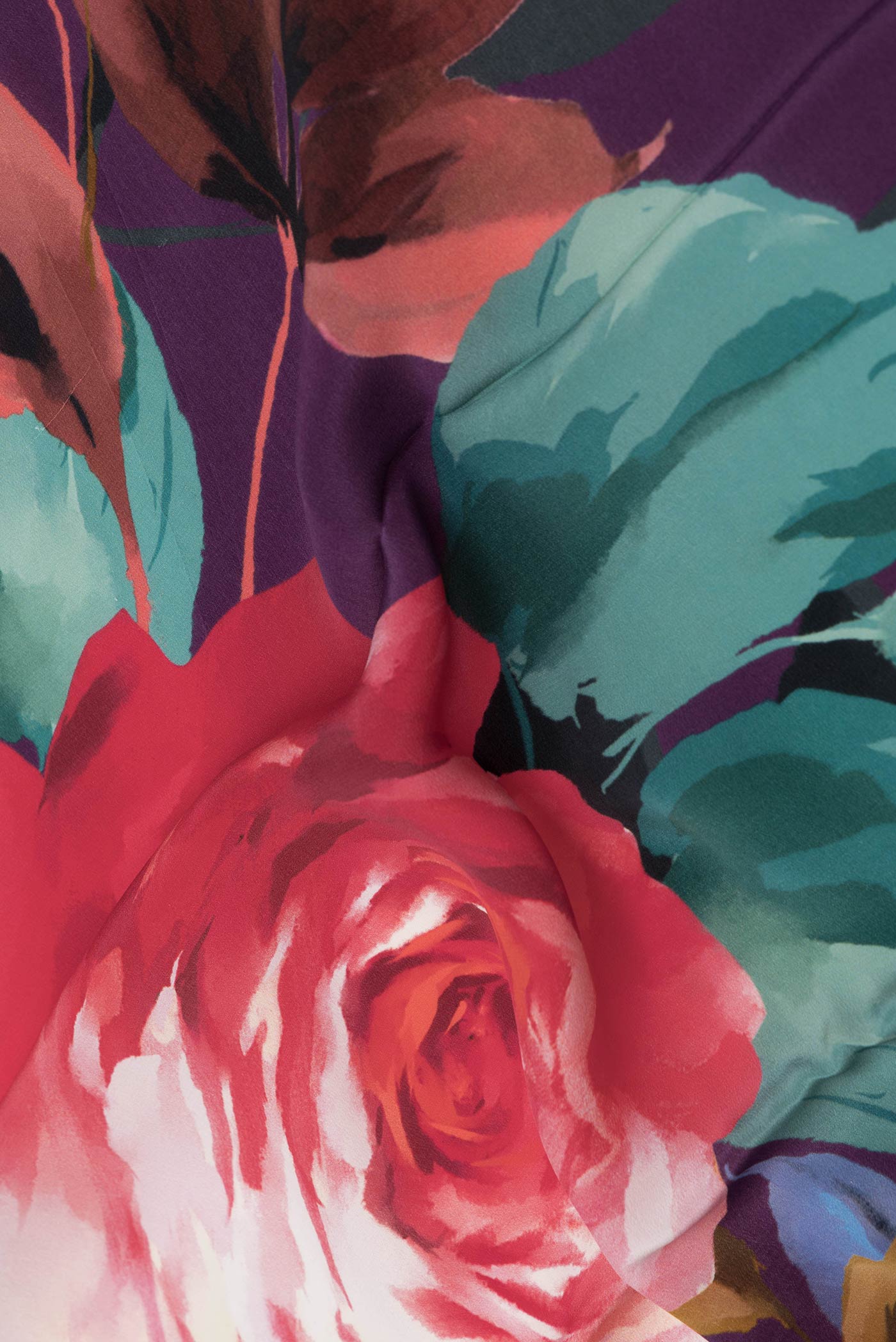 Close up of Purple Dual Tone Mysore Crepe Saree with Printed design on the body and Plain Border displaying folds