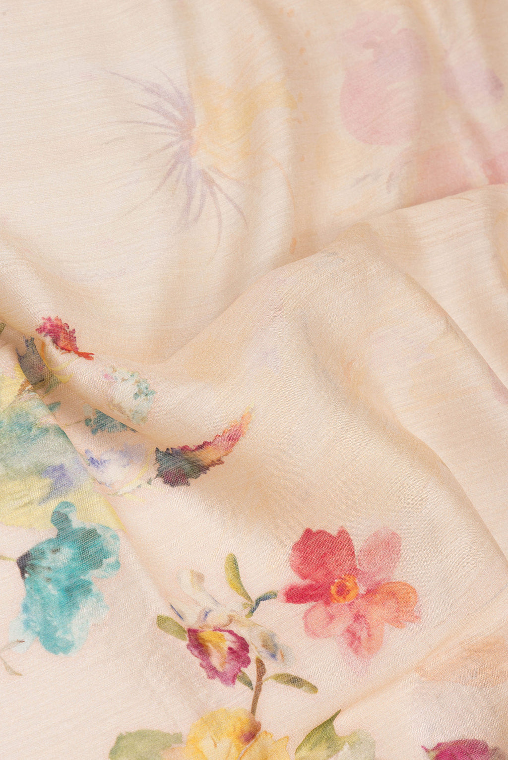 Close up of Beige Chanderi Silk Saree with Printed design on the body and Zari Border.  displaying folds