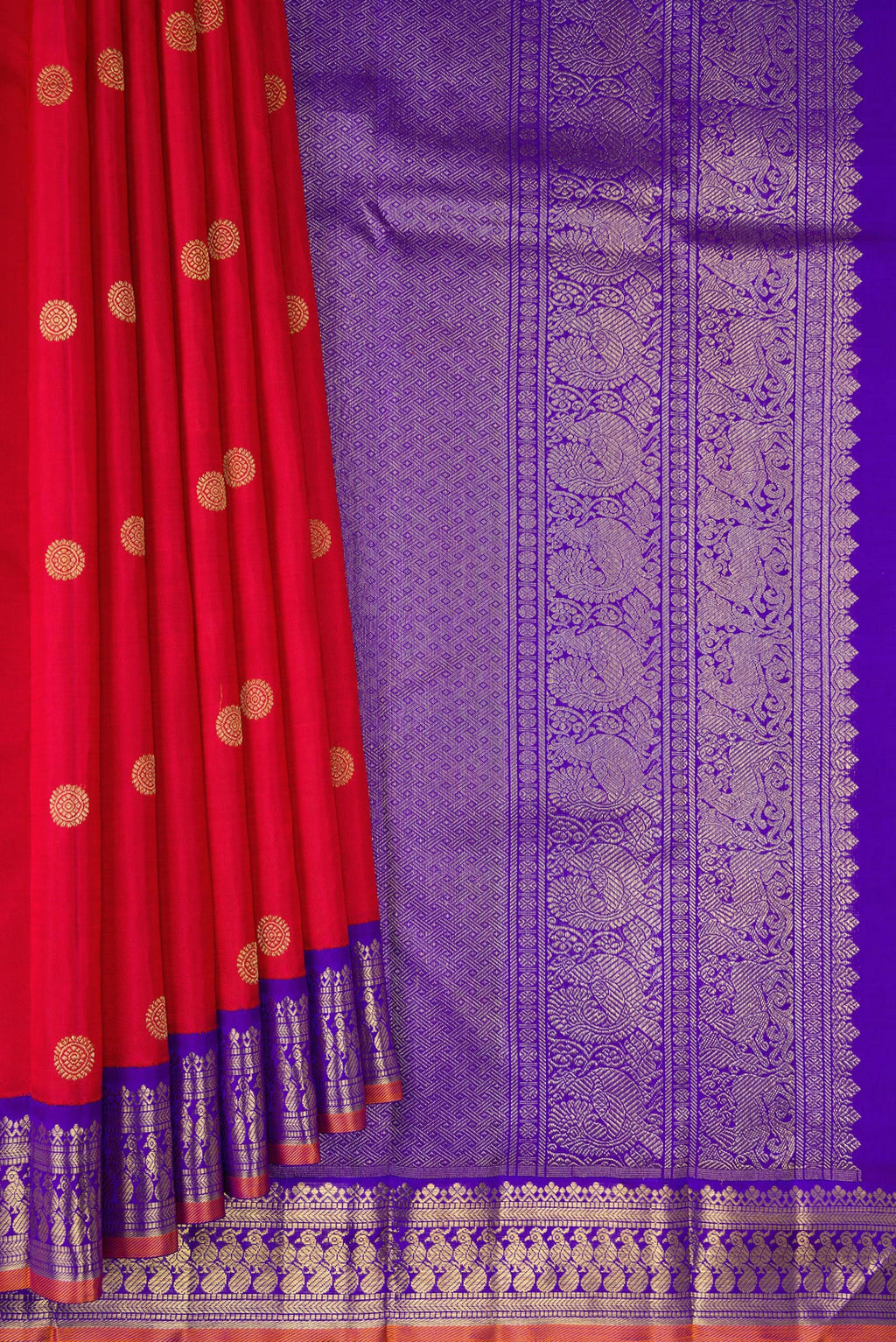 Pleats and pallu of Pure Silk Pure Zari Red Kanjivaram Saree with Zari Butta on the body and Fancy Border. 