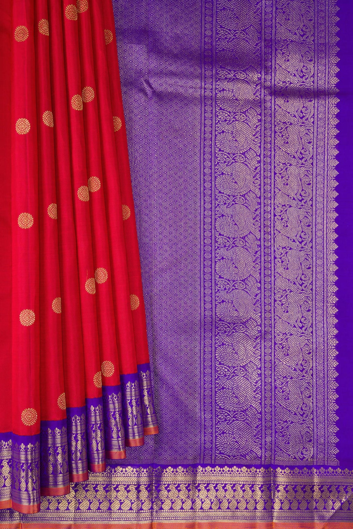 Pleats and pallu of Pure Silk Pure Zari Red Kanjivaram Saree with Zari Butta on the body and Fancy Border. 