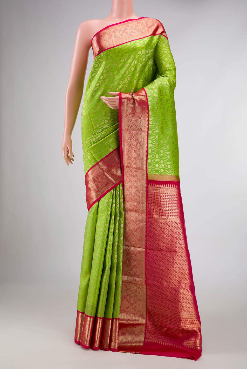 Parrot Green Dual Tone Kanchipuram Silk Saree with Zari Brocade on the body and Zari Border displayed on a mannequin
