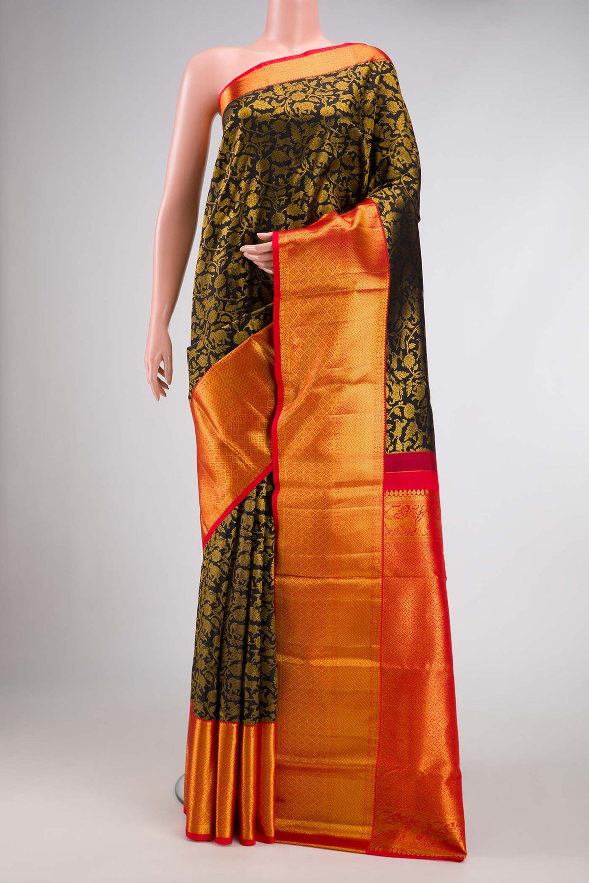 Black Dual Tone Kanjivaram Silk Saree with Zari Brocade on the body and Zari Border.  displayed on a mannequin