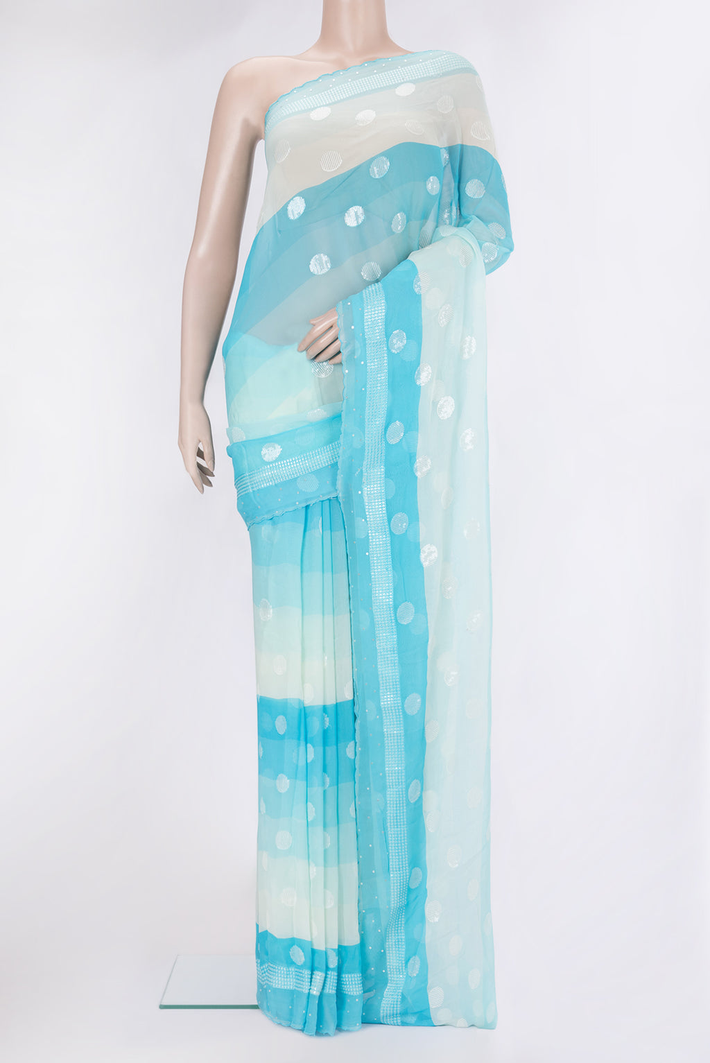 Sky Blue and Beige Color Georgette Saree with Embroidery on the body and Embroidery Border.  displayed on a mannequin