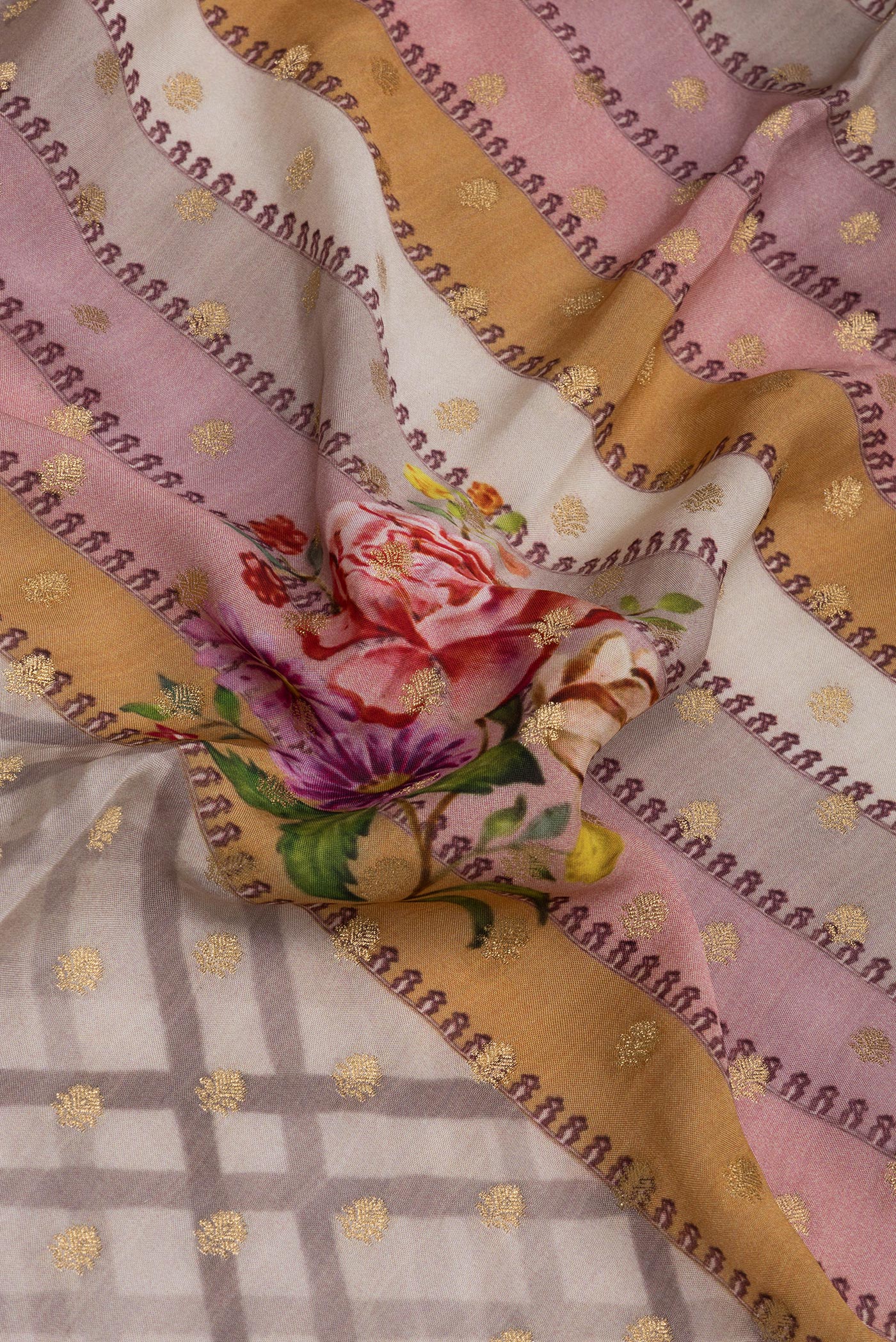 Close up of Lilac Tussar Silk Saree with Zari Butta on the body and Zari Border.  displaying folds
