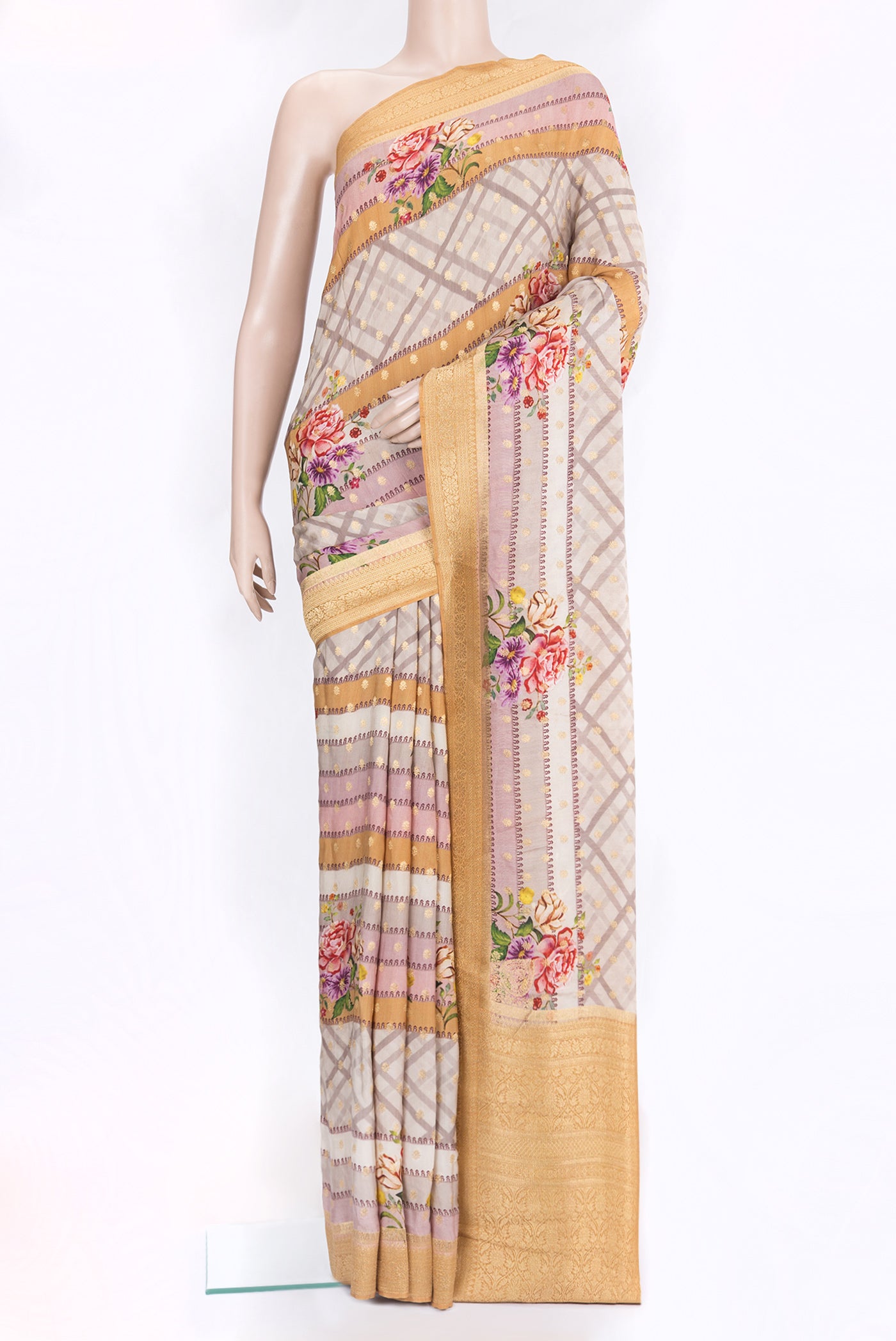 Lilac Tussar Silk Saree with Zari Butta on the body and Zari Border.  displayed on a mannequin