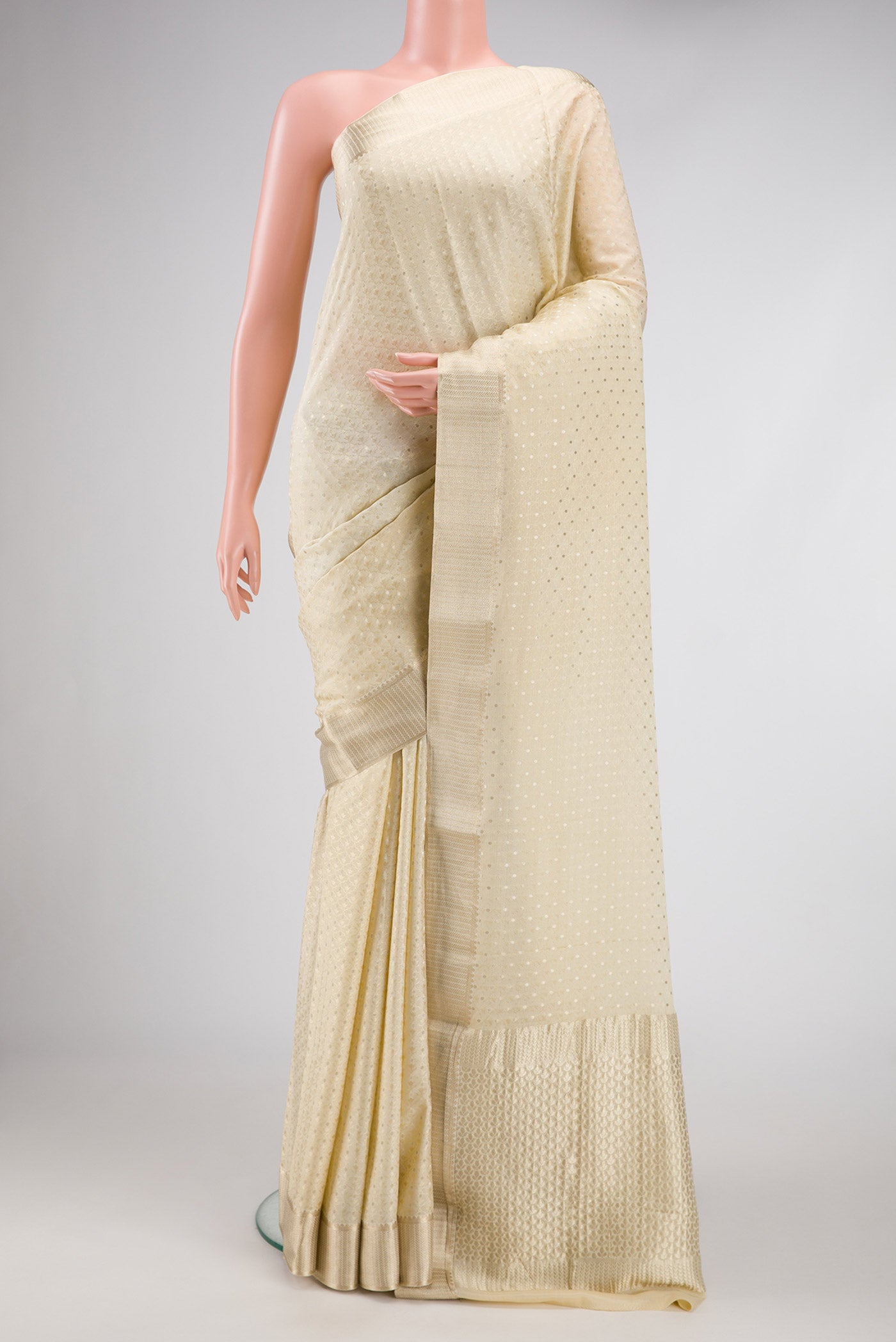 Beige Dual Tone Banarasi Georgette Saree with Jacquard With Zari Butta on the body and Zari Border.  displayed on a mannequin