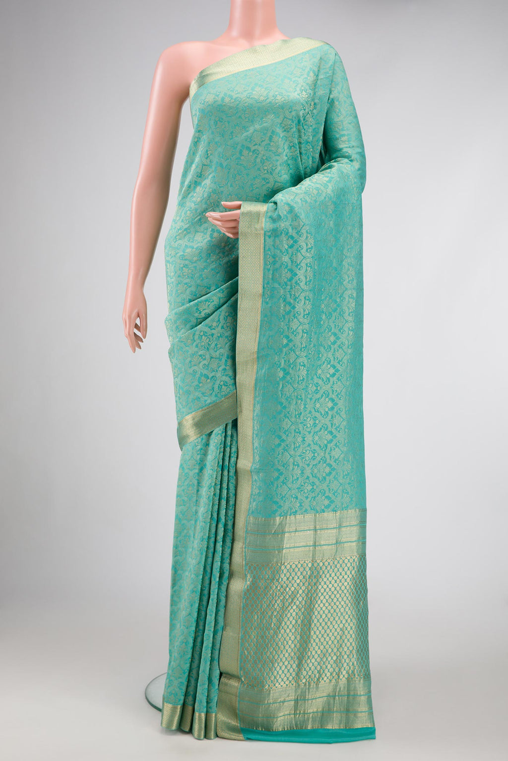 Sky Blue Dual Tone Banarasi Georgette Saree with Zari Brocade on the body and Zari Border.  displayed on a mannequin
