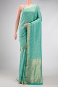 Sky Blue Dual Tone Banarasi Georgette Saree with Zari Brocade on the body and Zari Border.  displayed on a mannequin