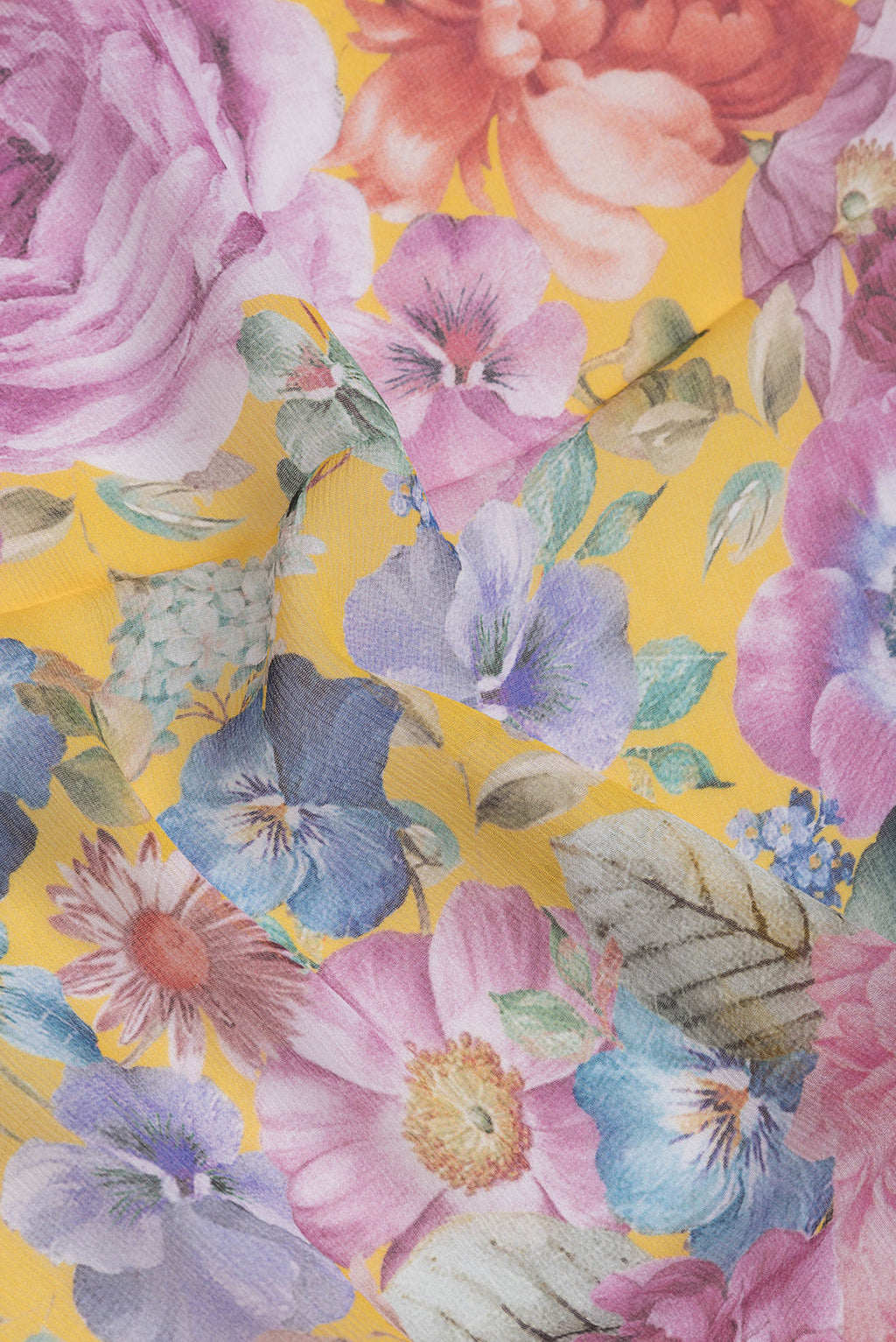 Close up of Yellow Mysore Chiffon Saree with Printed design on the body and Plain Border.  displaying folds