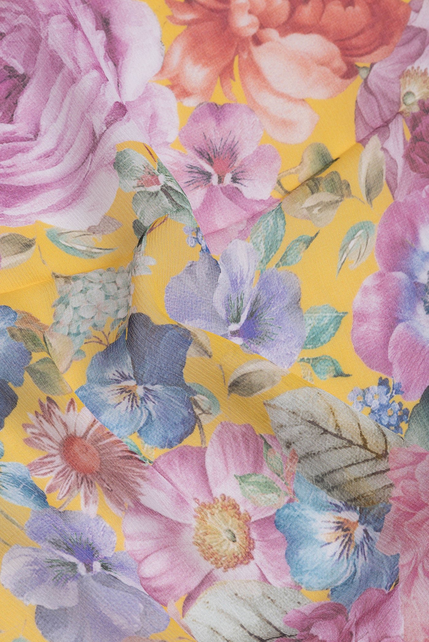 Close up of Yellow Mysore Chiffon Saree with Printed design on the body and Plain Border.  displaying folds
