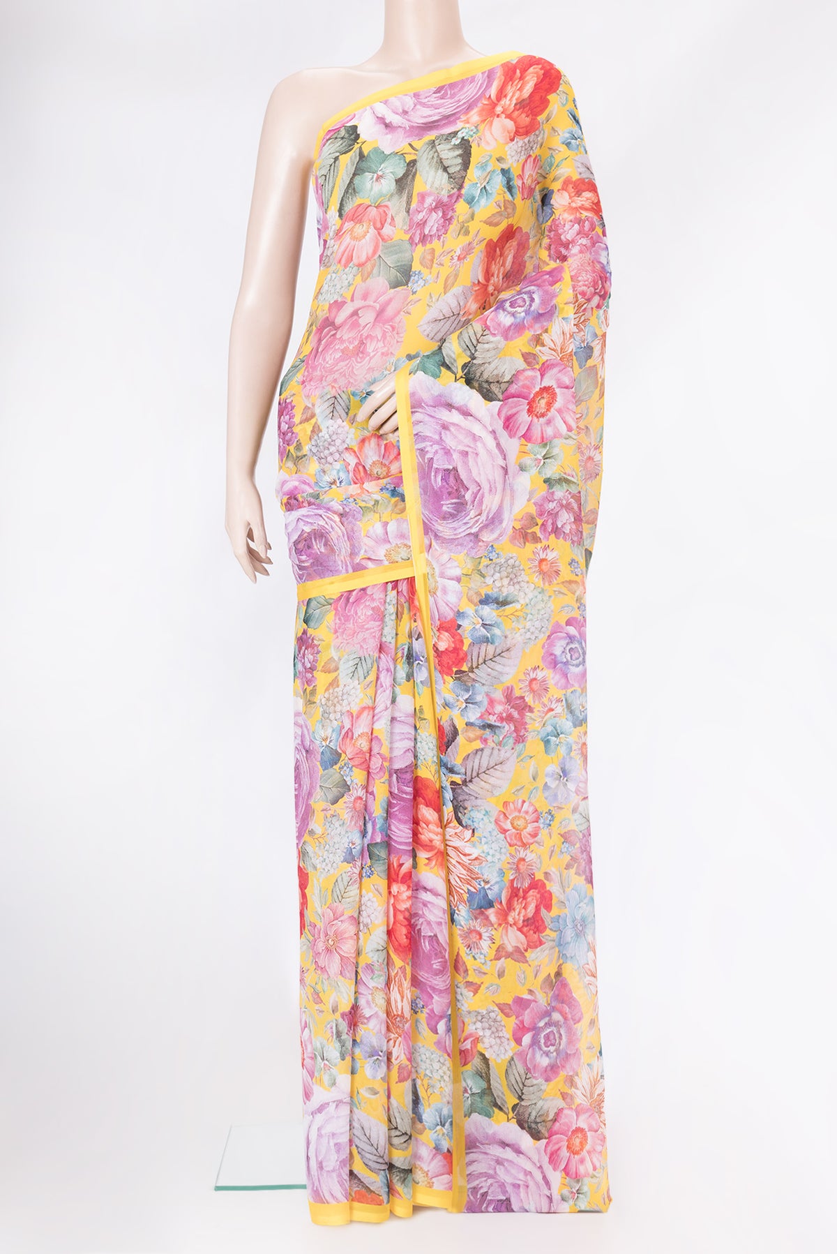 Yellow Mysore Chiffon Saree with Printed design on the body and Plain Border.  displayed on a mannequin