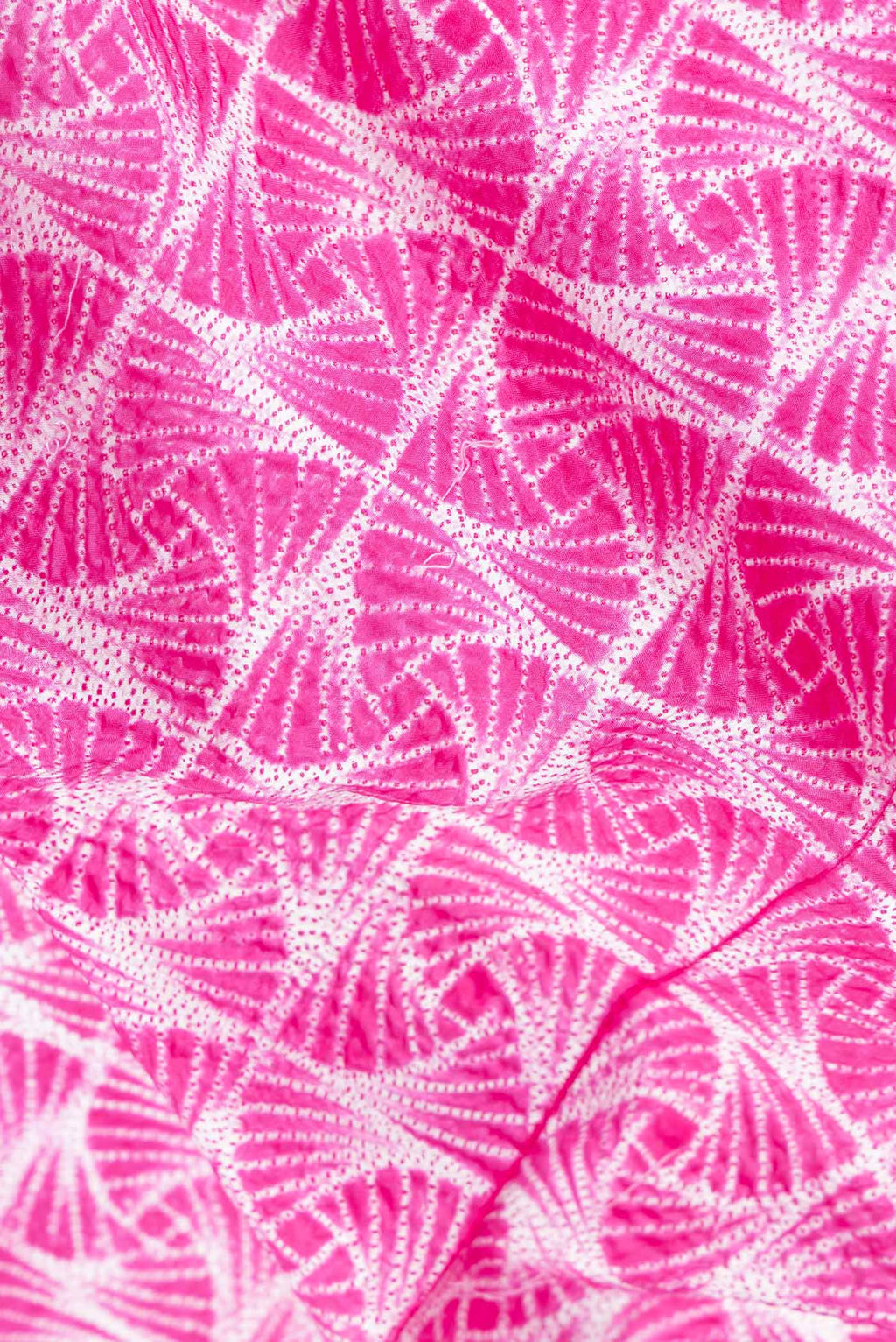 Close up of Pink Dual Tone Tussar Saree with Printed design on the body and Printed Border.  displaying folds