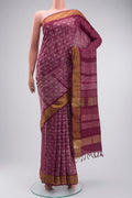 Mauve Tussar Silk Saree with Printed design on the body and Zari Border displayed on a mannequin