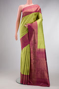 Pure Silk Pure Zari Parrot Green Dual Tone Kanjivaram Saree with Zari Brocade on the body and Zari Border.  displayed on a mannequin