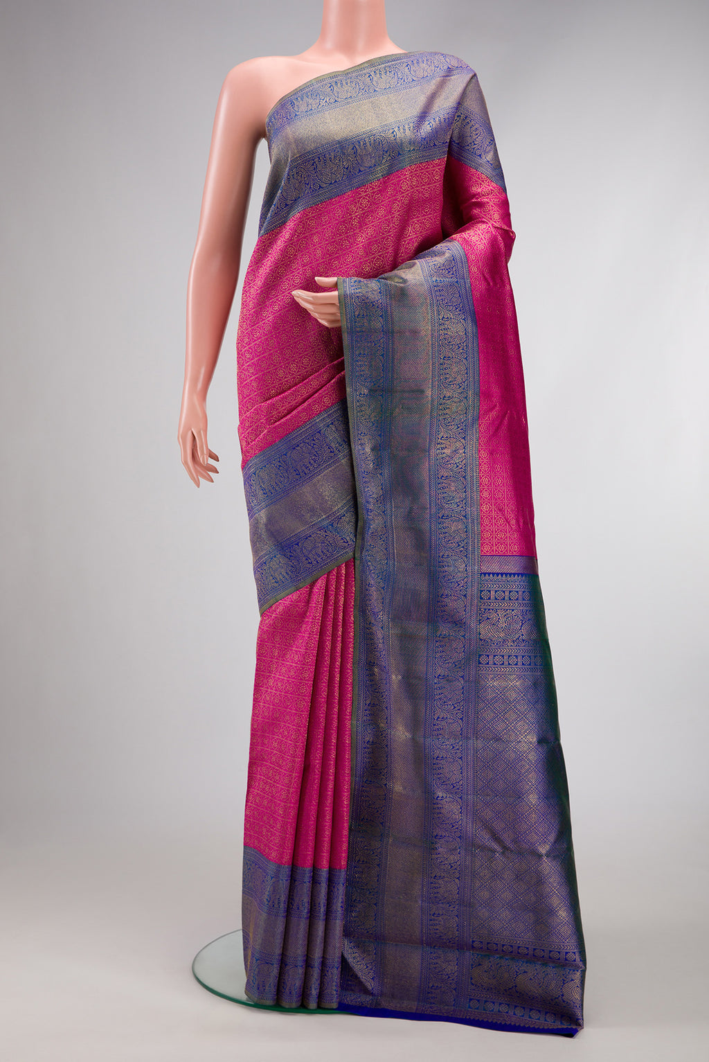 Dark Pink Dual Tone Kanjivaram Silk Saree with Zari Brocade on the body and Zari Border.  displayed on a mannequin