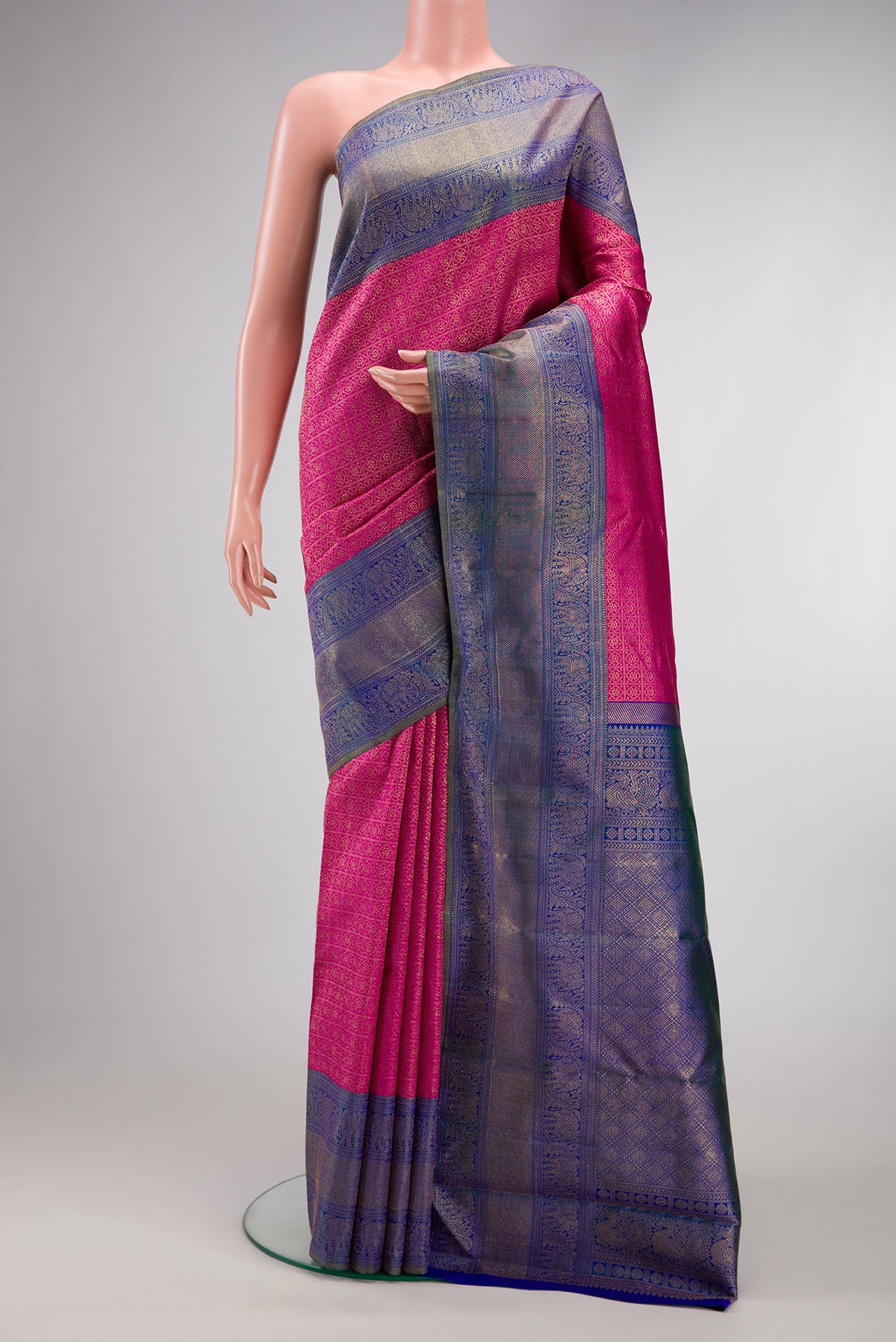Dark Pink Dual Tone Kanjivaram Silk Saree with Zari Brocade on the body and Zari Border.  displayed on a mannequin
