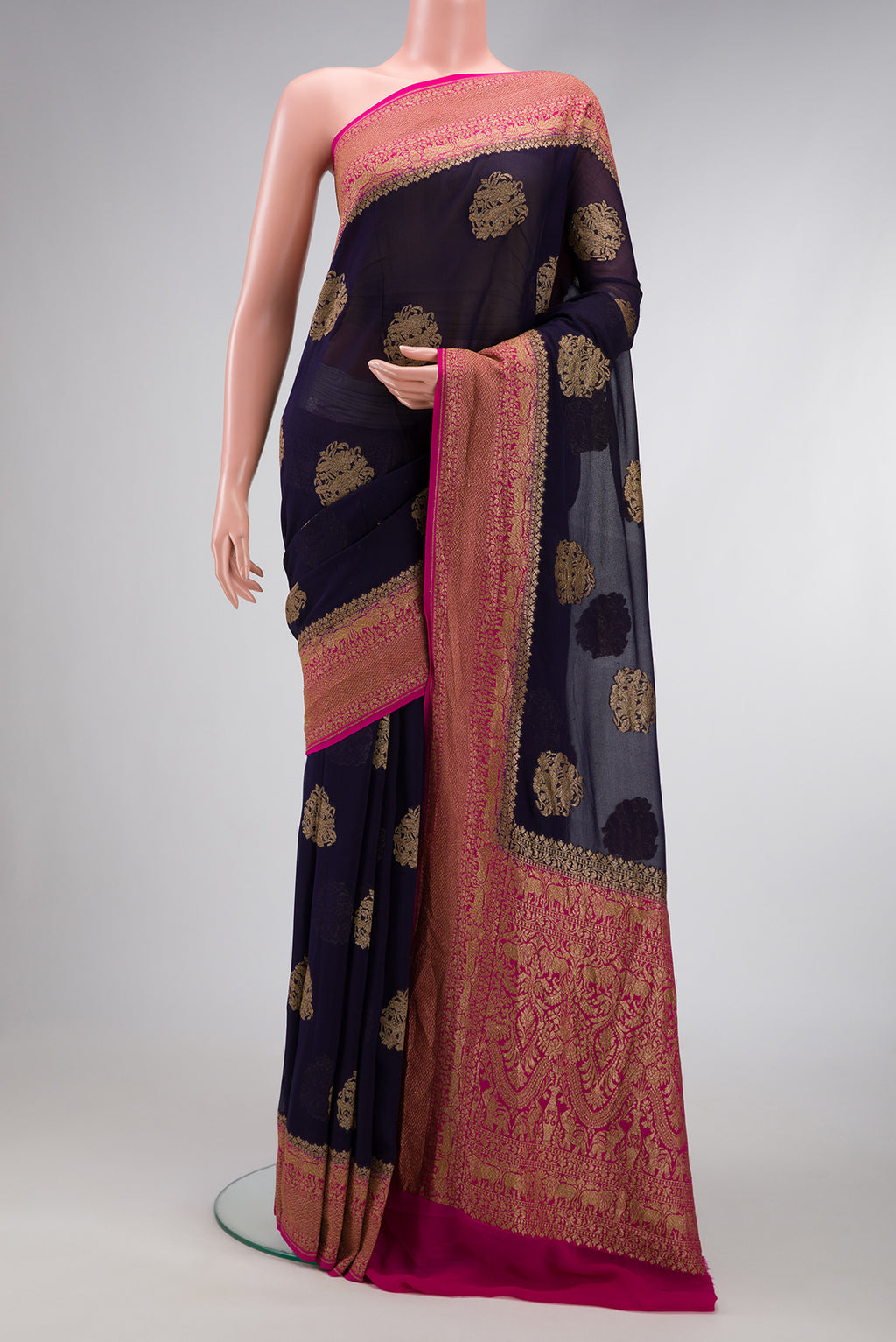 Navy Blue Dual Tone Mysore Georgette Saree with Zari Butta on the body and Zari Border.  displayed on a mannequin