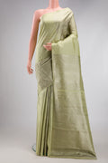 Pista Green Kanjivaram Silk Saree with Zari Brocade on the body and Without Border.  displayed on a mannequin