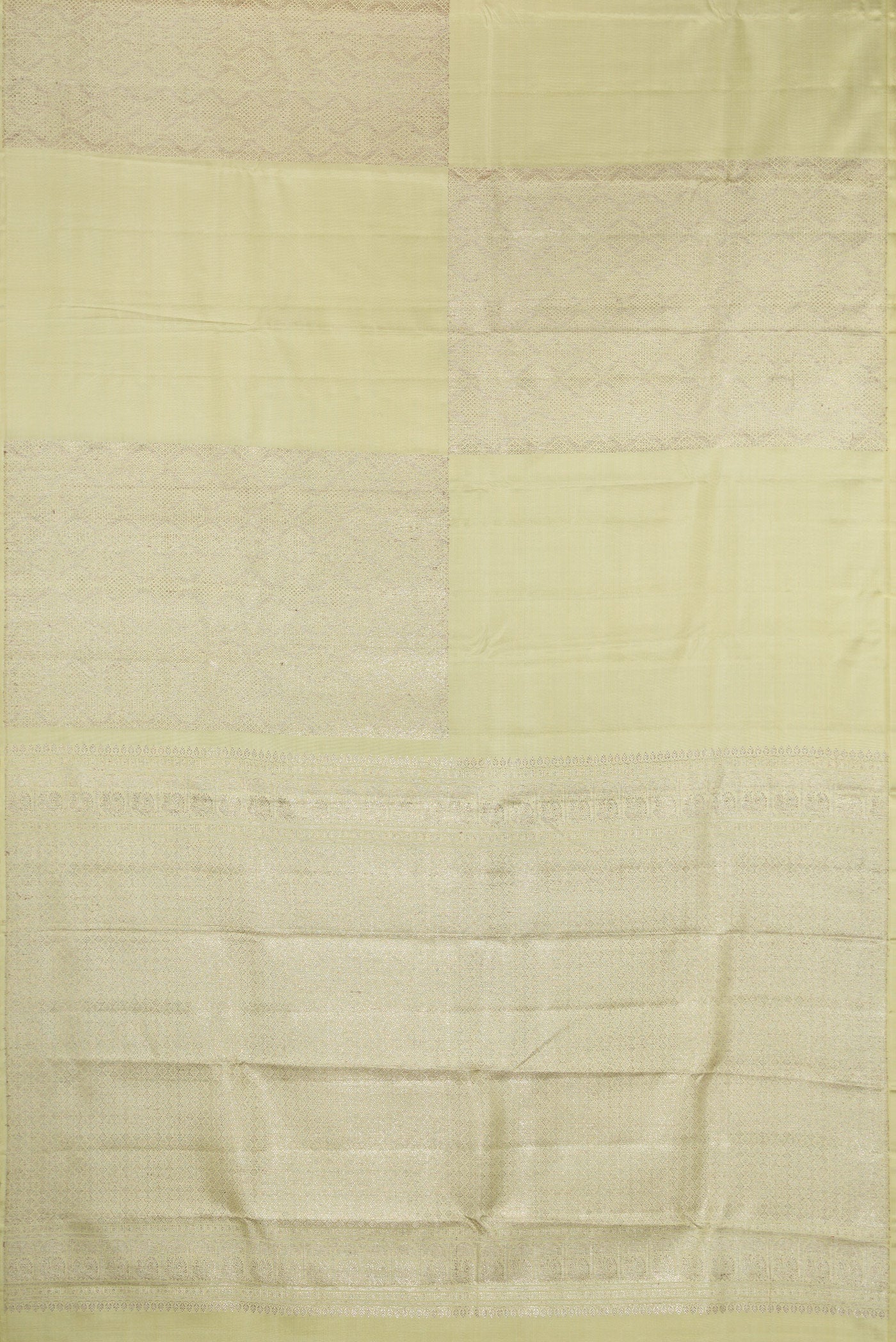 Flat view of Pista Green Kanjivaram Silk Saree with Zari Brocade on the body and Without Border. 