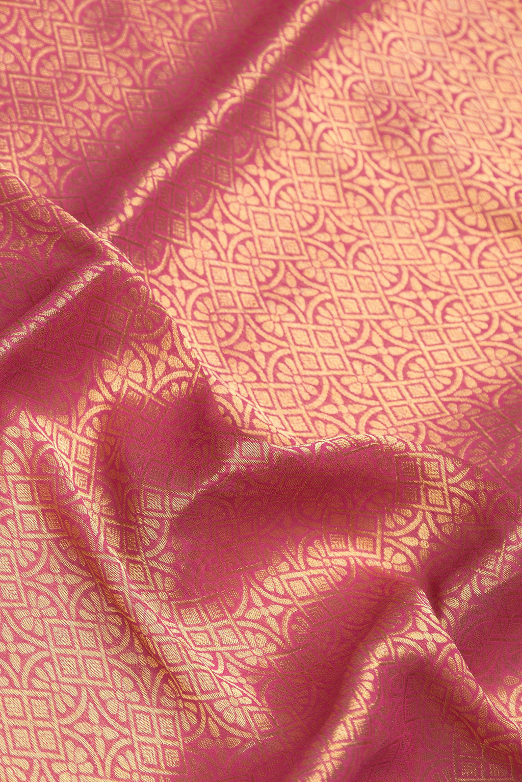 Close up of Pink Mysore Georgette Saree with Zari Brocade on the body and Zari Border.  displaying folds